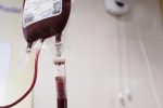 a blood test tube with a blood dropper attached to it