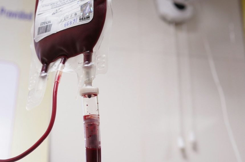 a blood test tube with a blood dropper attached to it